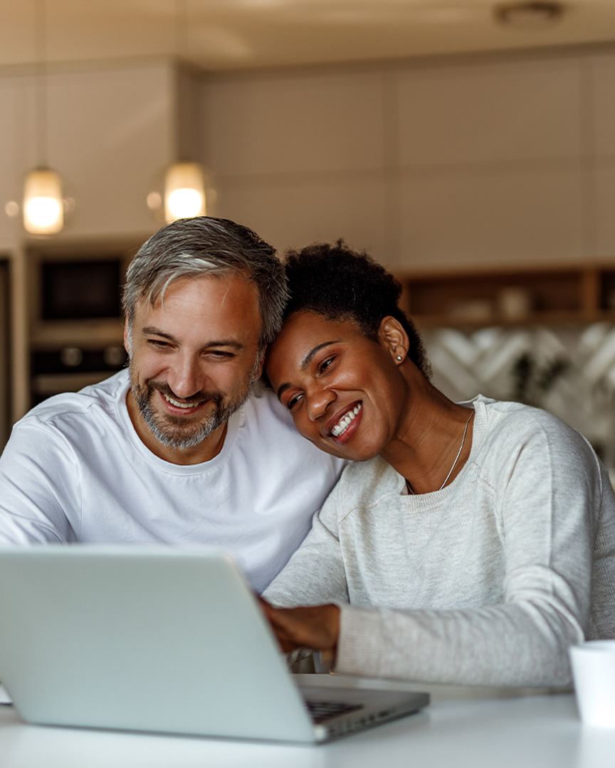 A couple plans a dream vacation using their Visa Signature Card.