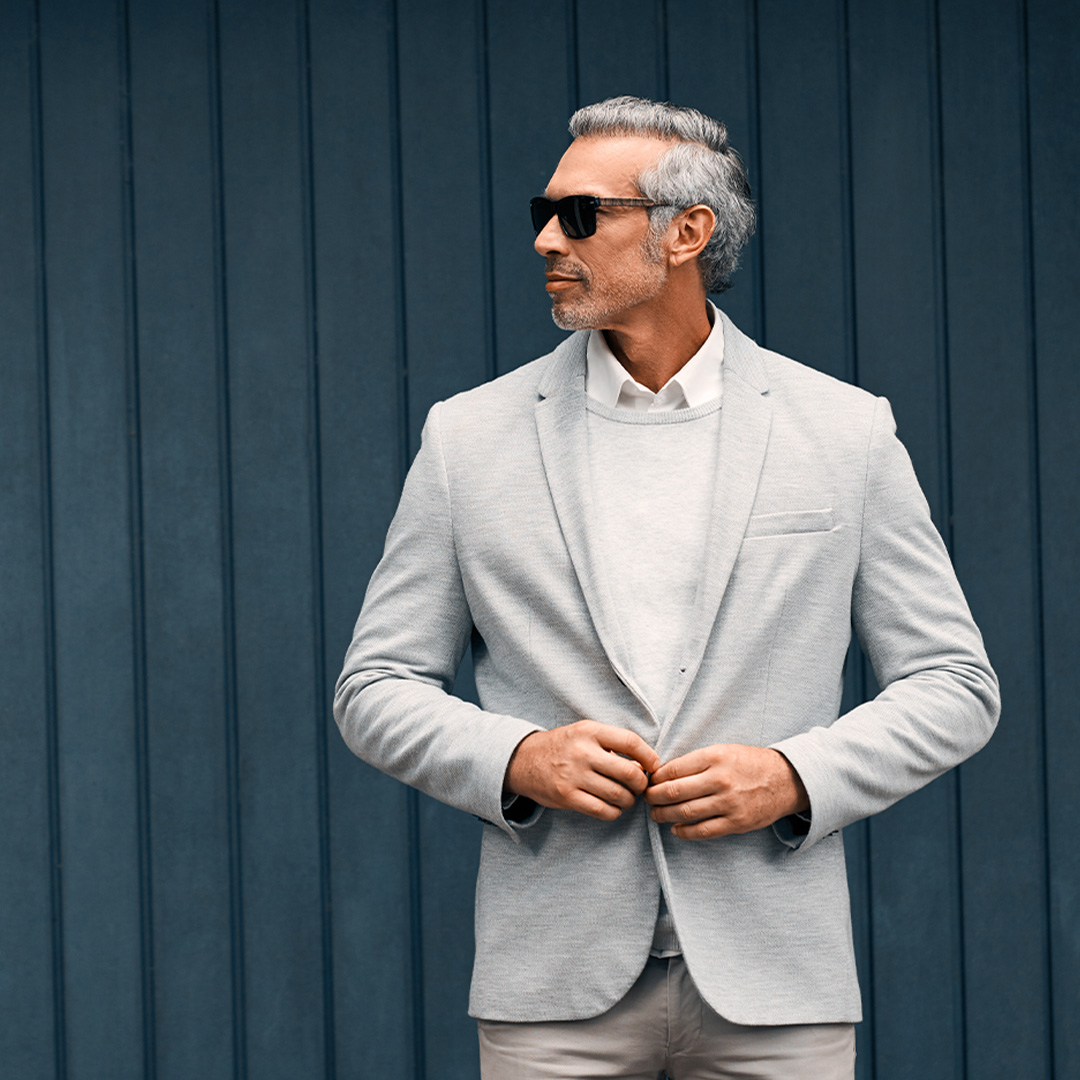 A well-dressed man in a tailored suit.