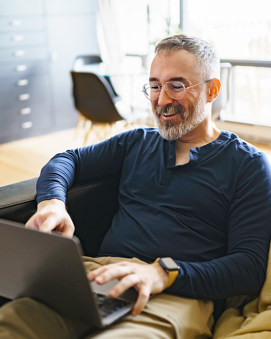 An investor checks their online asset allocations account on a laptop.