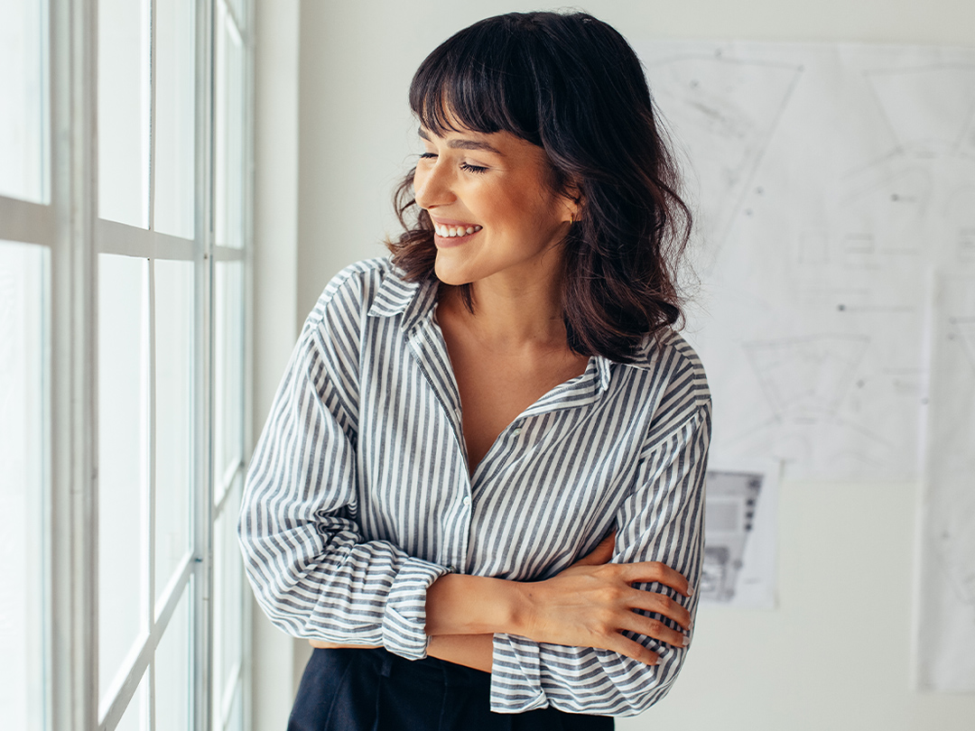 A business person in the office thinking about investing.